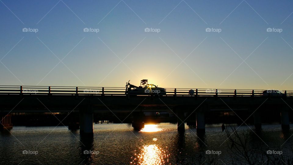 Silhouette of Truck Crossing Bridge