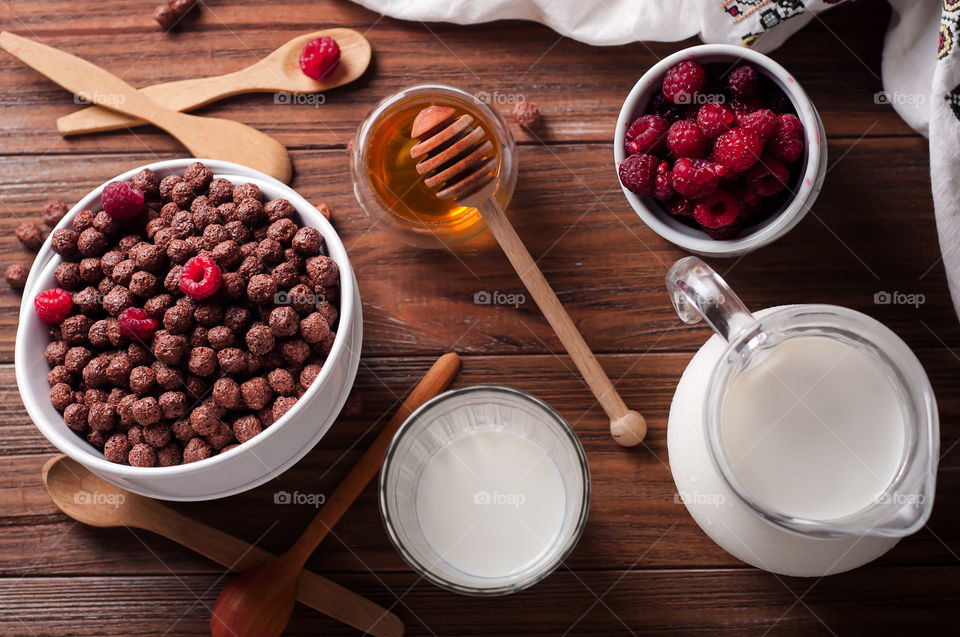 Chocolate balls with milk and raspberries