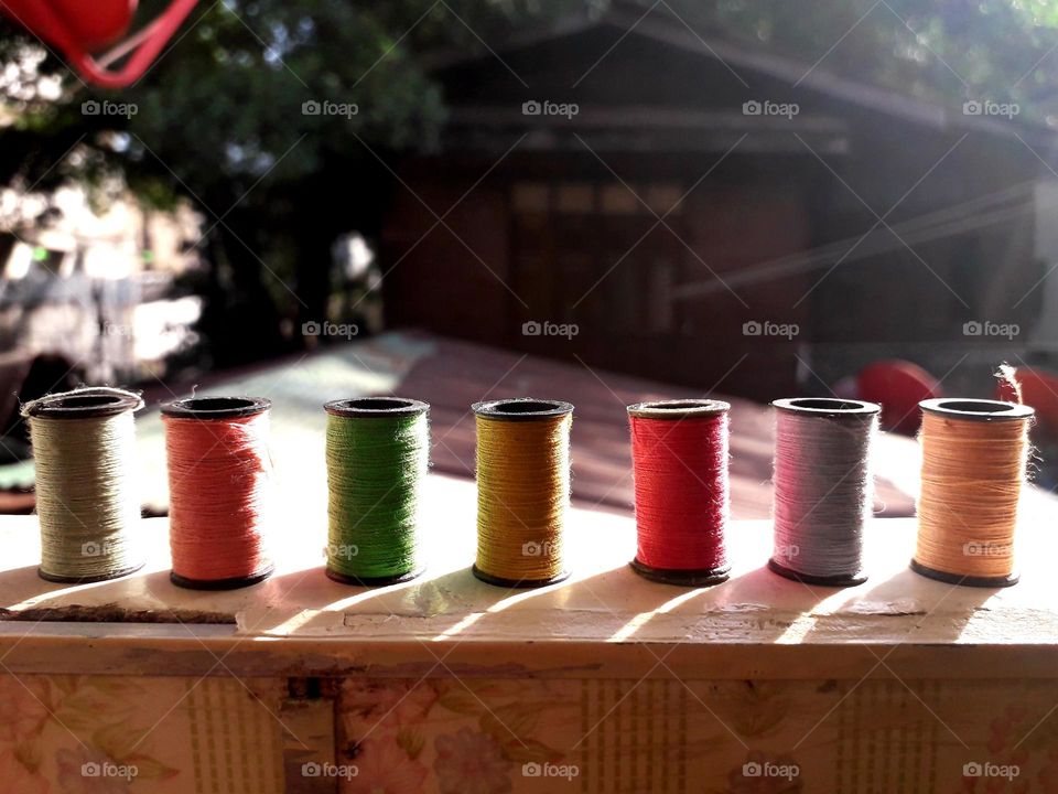 different colored threads