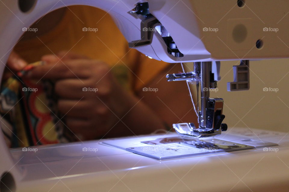 Woman working on sewing machine