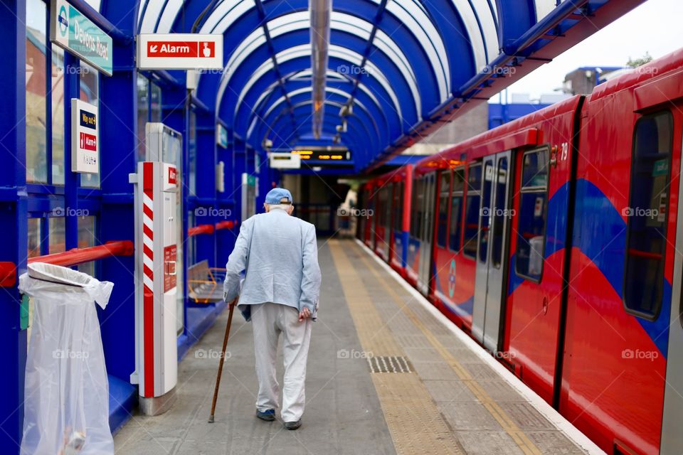 Old man leaving the DLR 