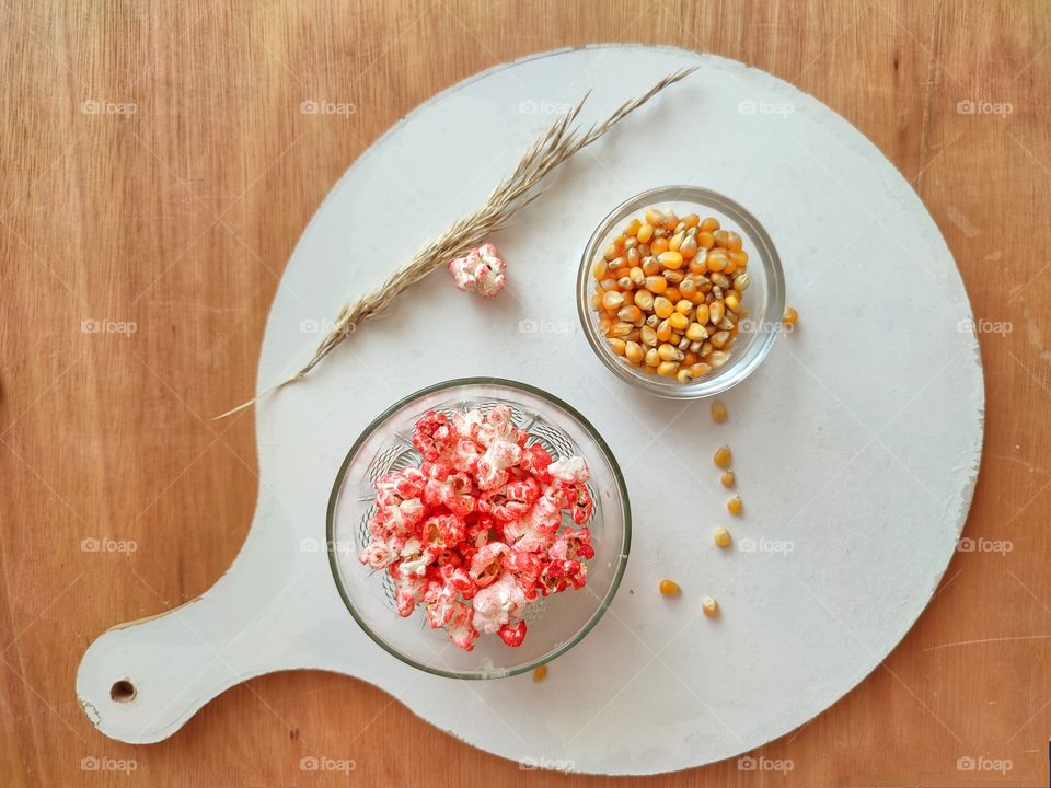 a popcorn on wooden table