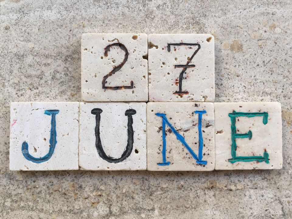 27th June, calendar date. Composition with carved travertine pieces of 27th June, calendar date