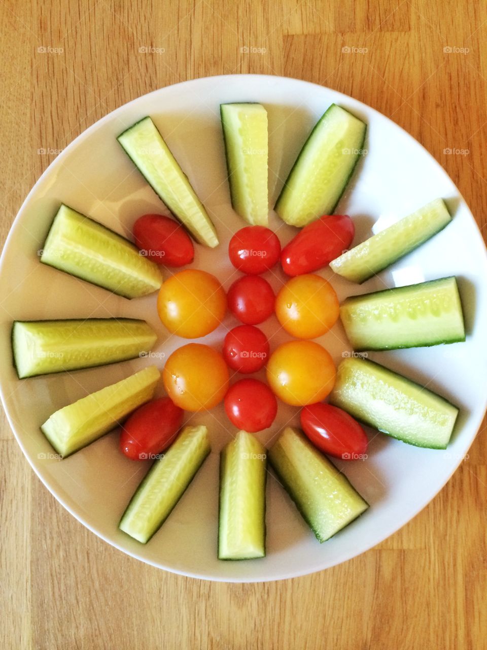 Tomatoes and cucumbers in a bowl. Tomatoes and cucumbers in a bowl