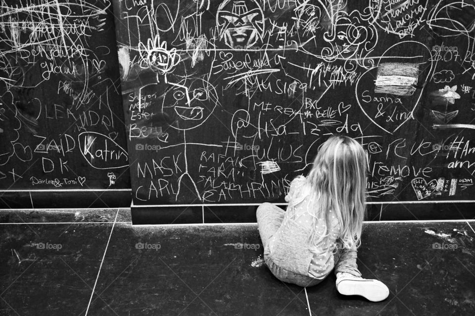 B&W ... photo of a little girl enjoying a bit of chalking 