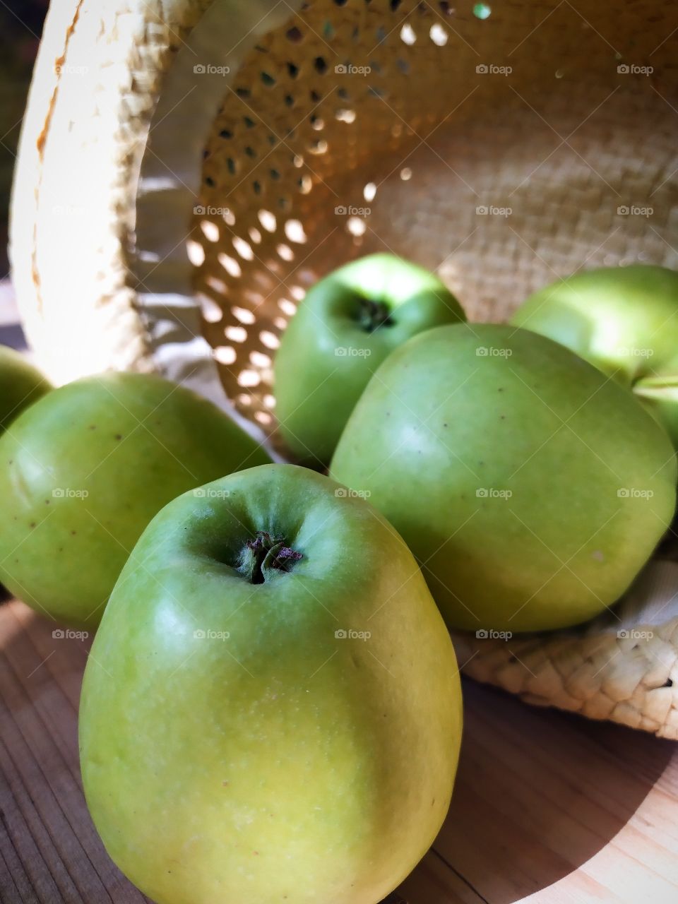 Green apples and straw hat