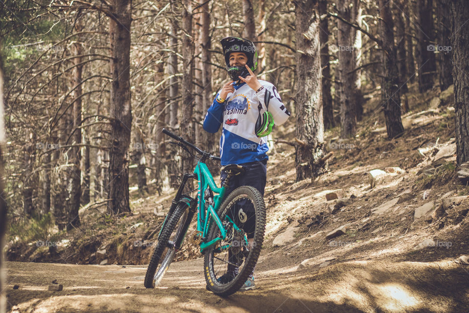 Girl riding bike in the forest