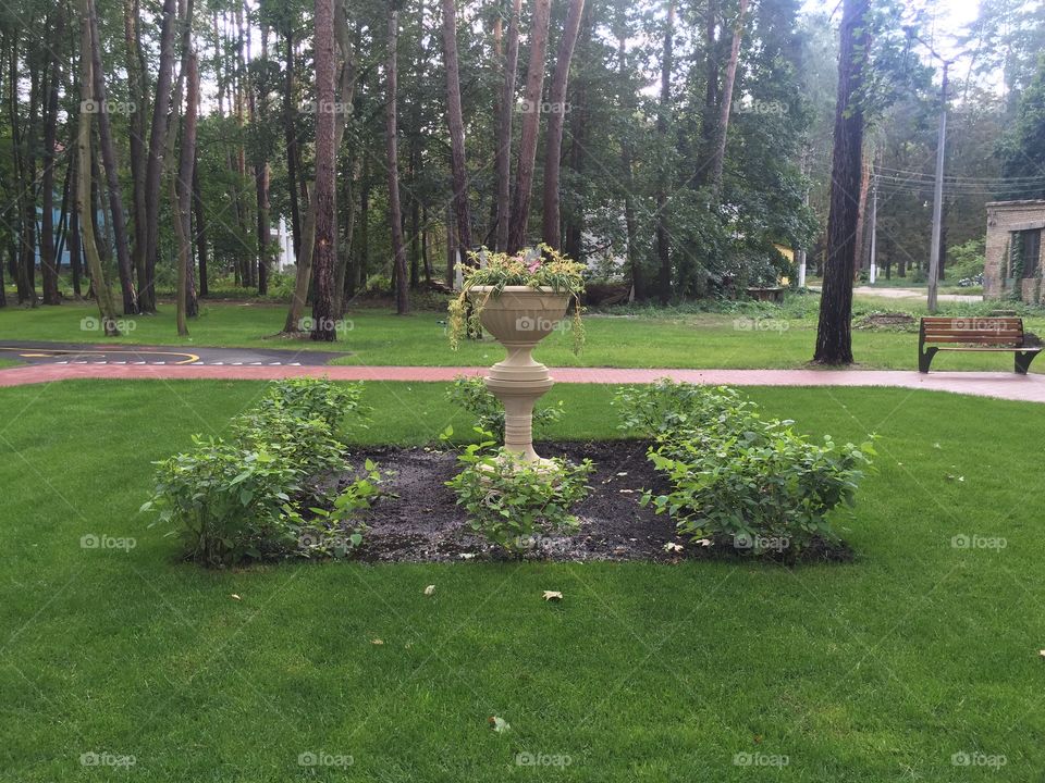 Flower bed with flower pot