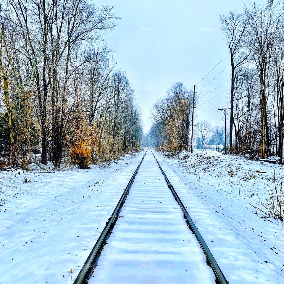 Snowy railroad tracks on a winter day in Indiana after a snow 