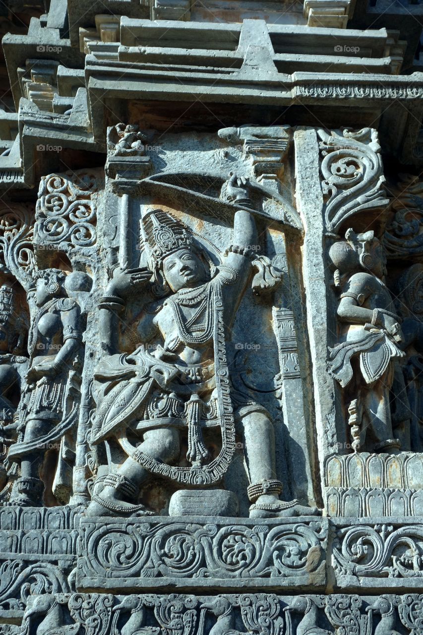 Halebeedu Hoysaleeswara temple - Arjuna aiming for a fish eye by seeing its reflection in oil bowl - bow contest