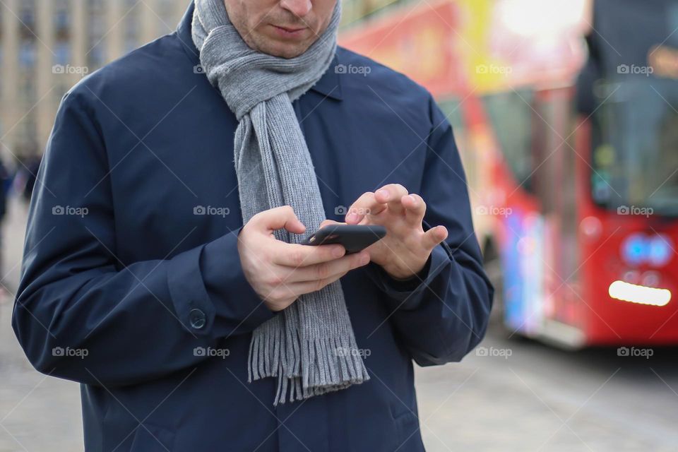 Man looks for the way in his phone. Tourist in Europe 