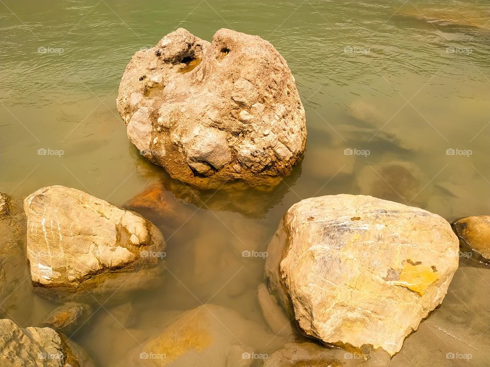 River stream of water flowing on stons