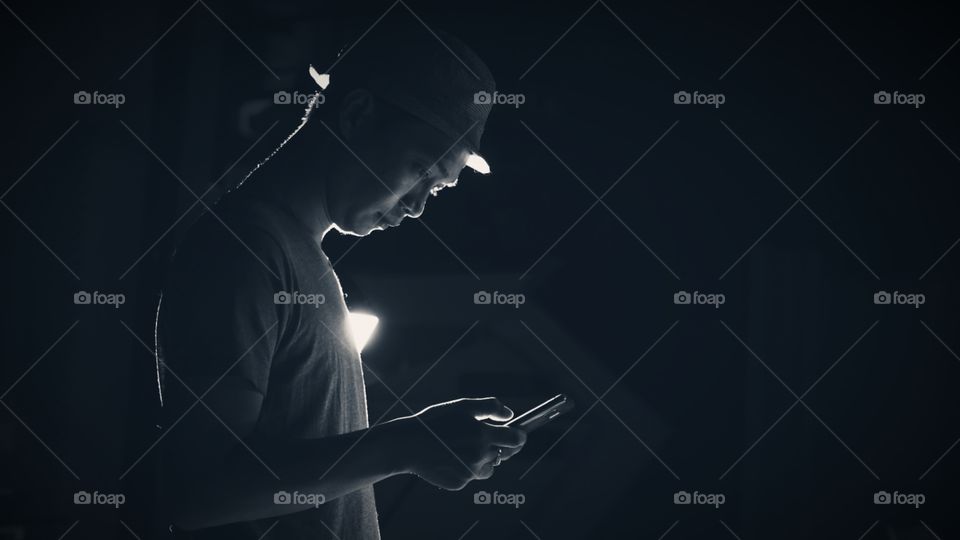 man playing smartphone