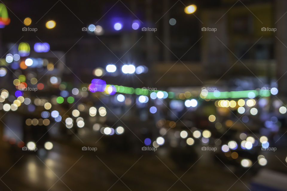 Lights blurred lights of cars on the road used as a background.