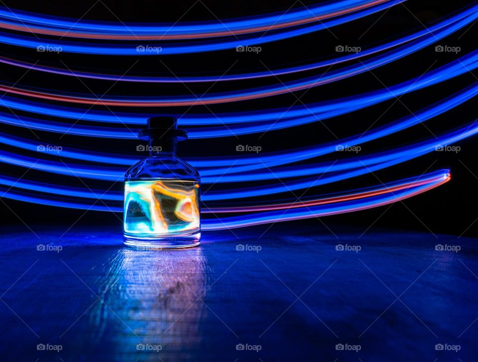 A bottle with a homemade flavor with lighting effect neon in the style of 70s