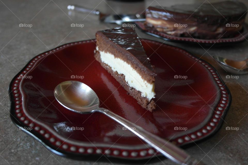 A peace of chocolate cake on a plate 