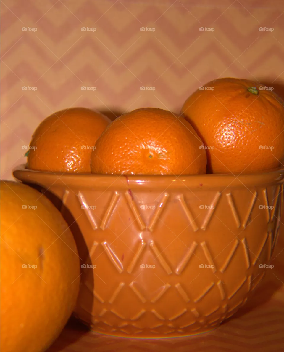 Orang Bowl of Oranges with Orange Abstract Background