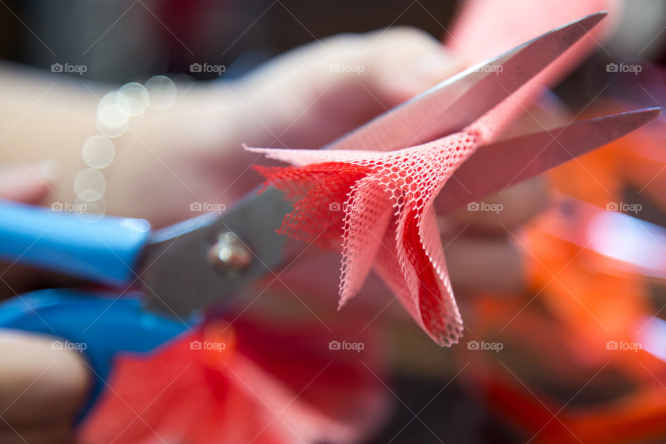 Close-up of hand holding sissors