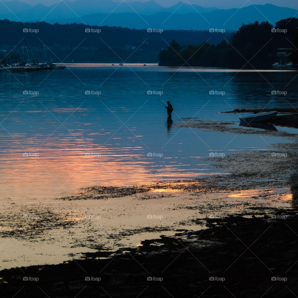 Fisherman in Lake Maggiore in Italy