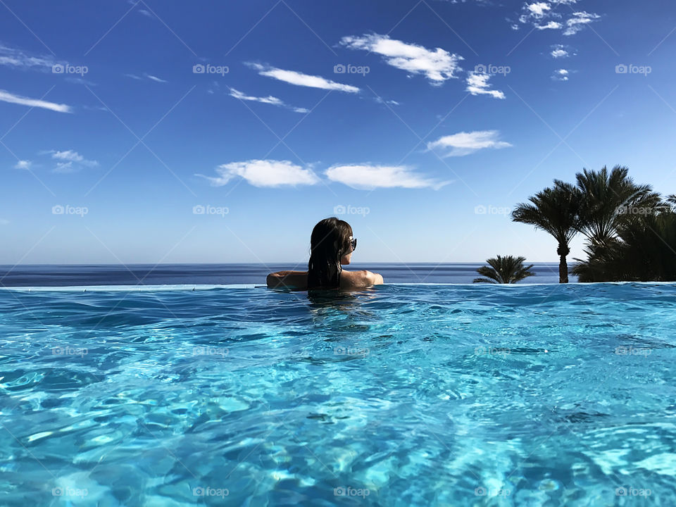 Young woman at the swimming pool 