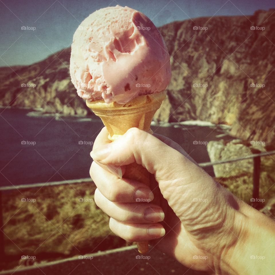 Ice cream cone. Hand holding an ice cream cone