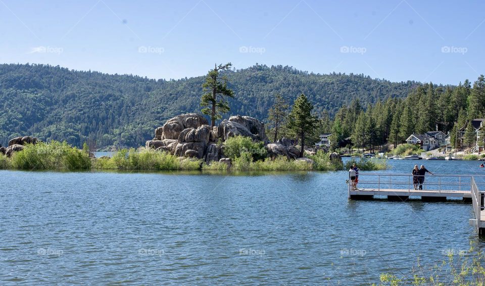 A beautiful,mountain lake scene with trees in the background 