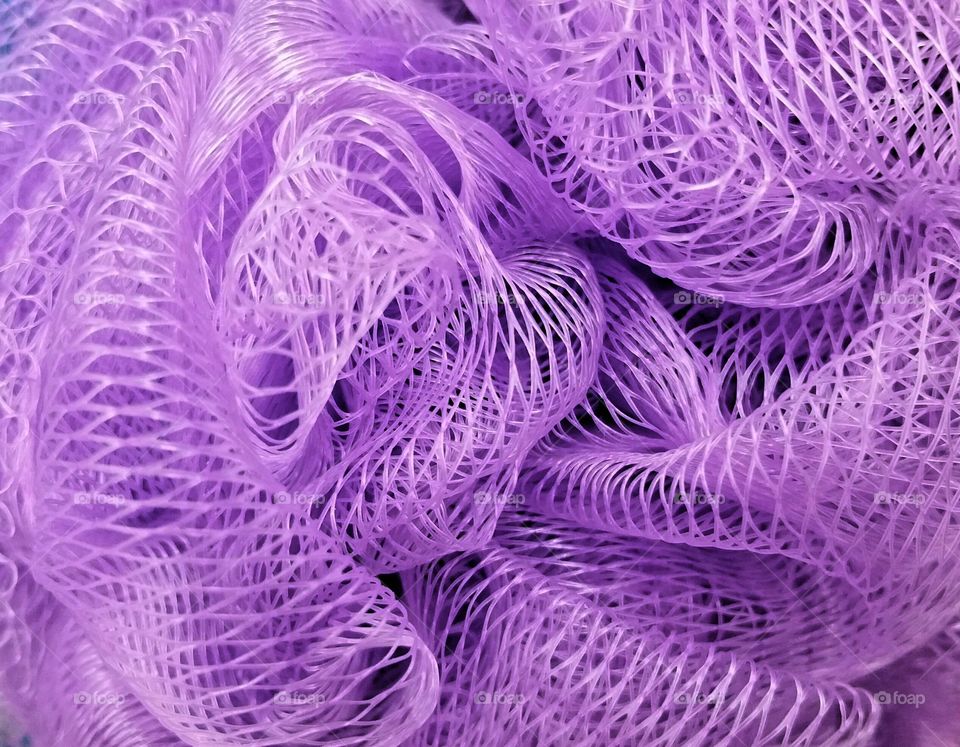 Purple mesh bath sponge