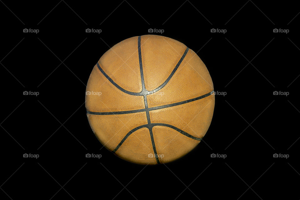 Basketball leather on a black background with clipping path.