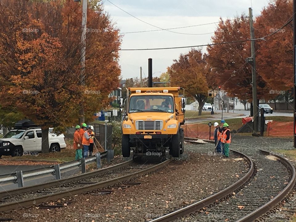 Workmen and truck on rails