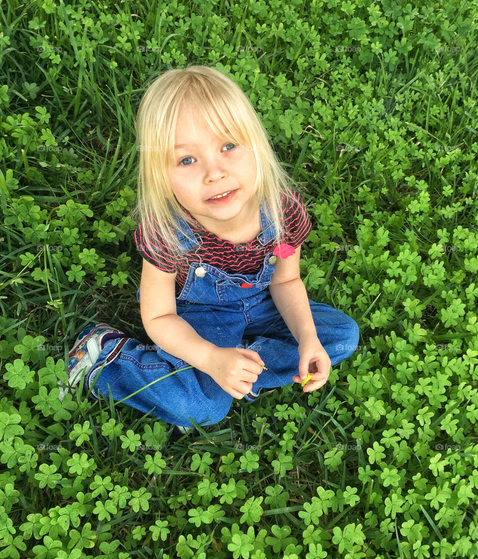 Daughter surrounded by clovers