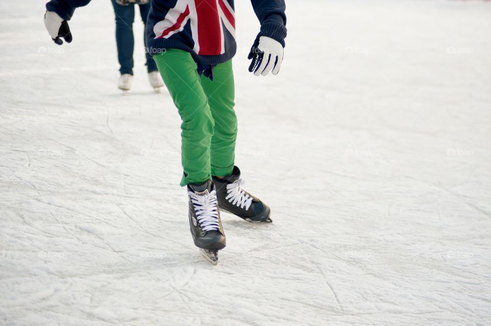 teenager skates on ice