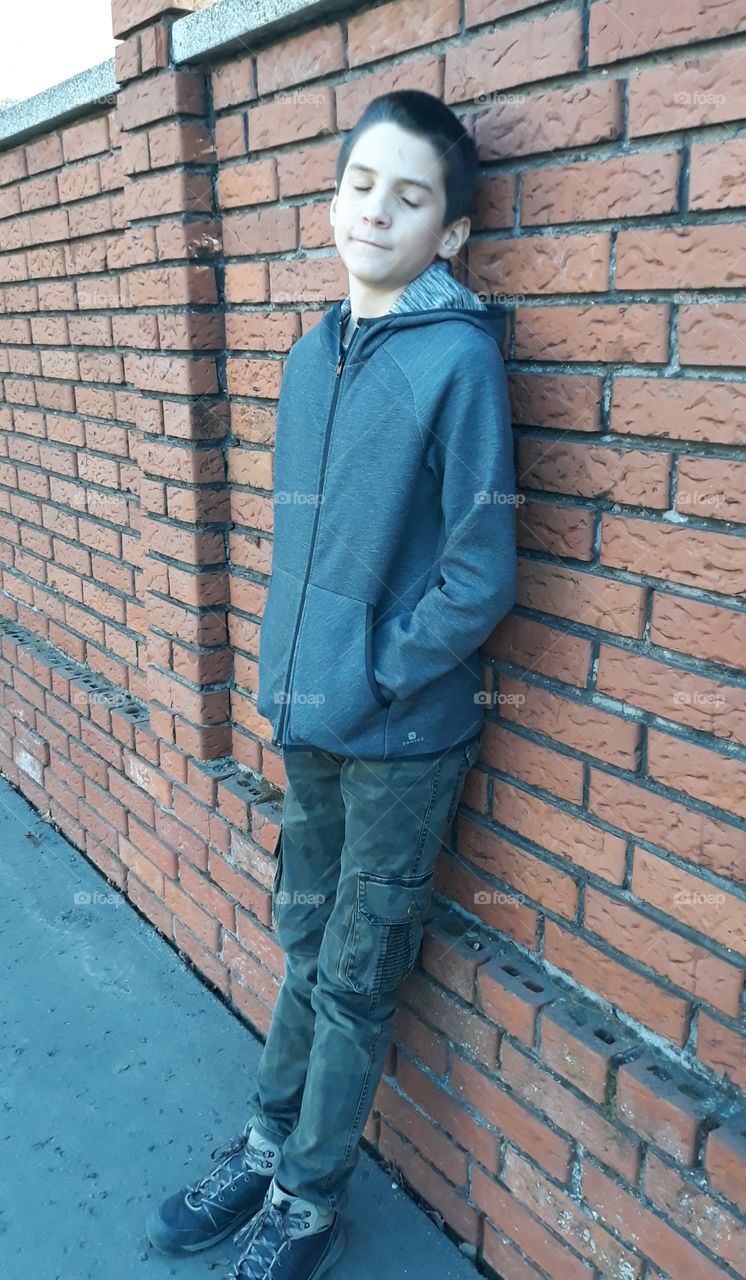 boy in the brick wall