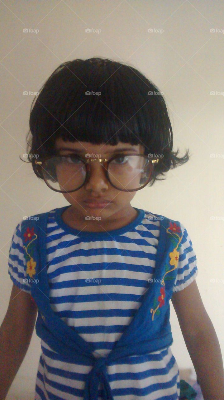kid wearing a big spec...