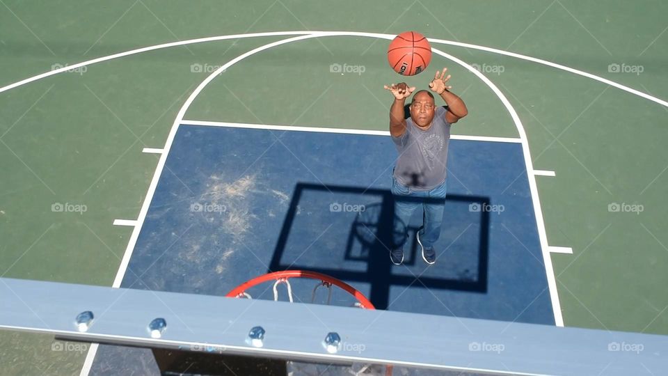 basketball jump shot on a outdoor basketball court