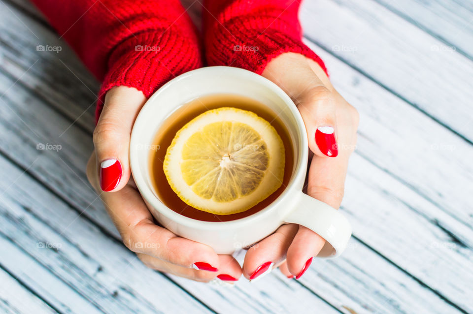 woman hand with cup of tea