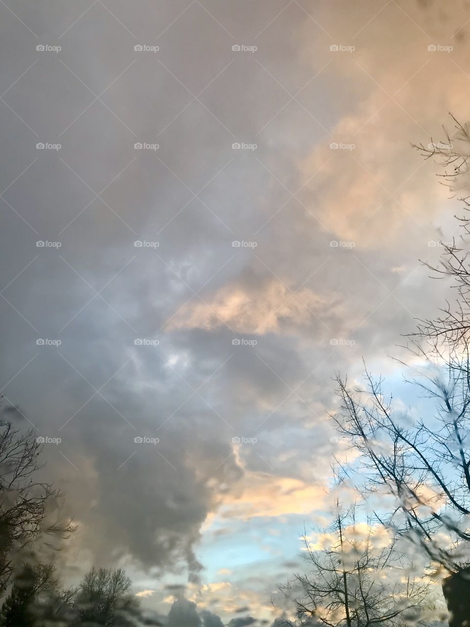 Beautiful Gray and pink cloudy and sunny skies on a winters evening in the USA , America 