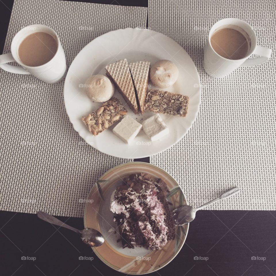 Desserts and coffee for two in one on a table