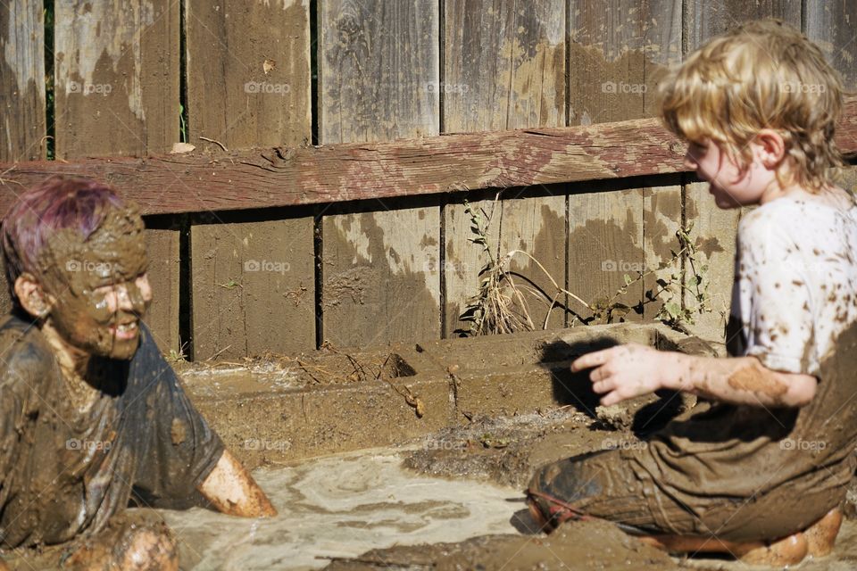 Boys Playing In Mud