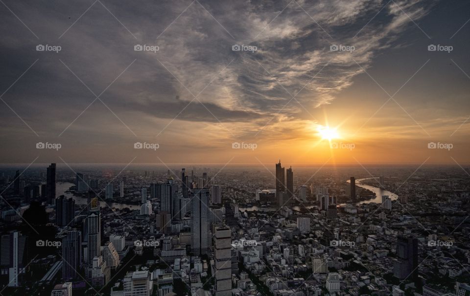 Romantic sunset in the central city Bangkok Thailand , photo from the roof top of King Power MahaNakhon