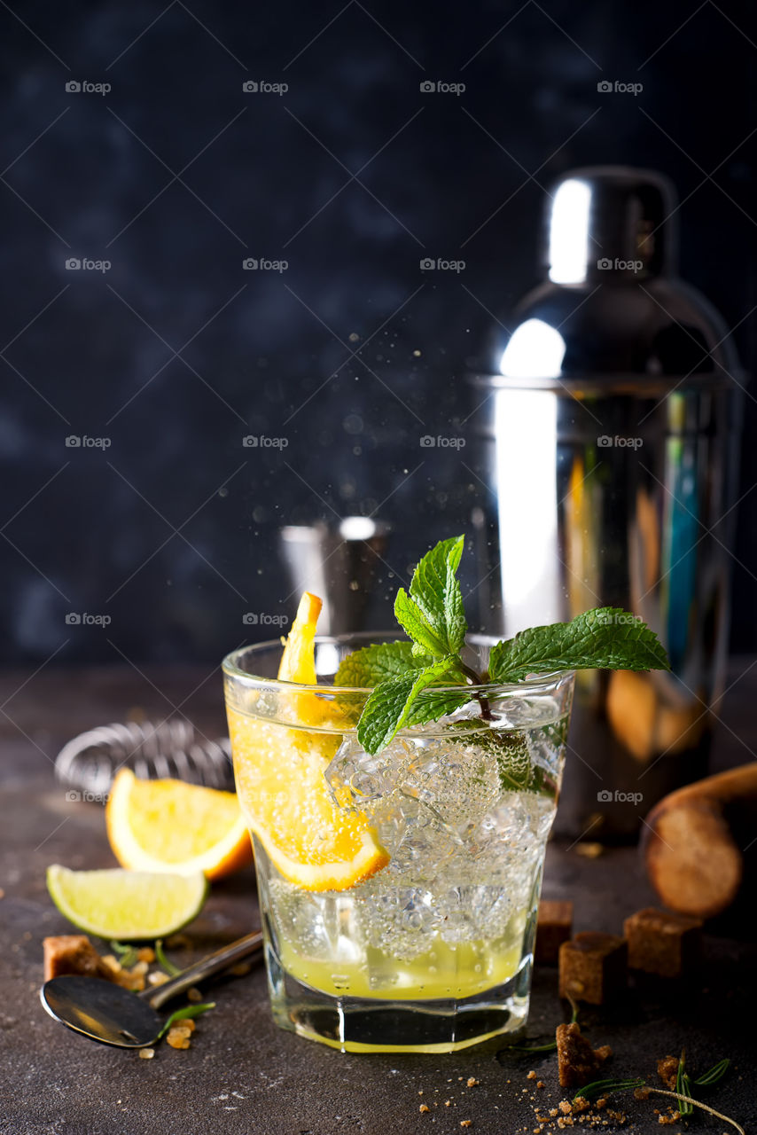 cold summer cocktail with ice and slice citrus