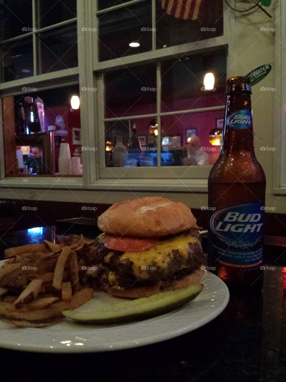 Happy Hour. long day, light beer, heavy burger! 