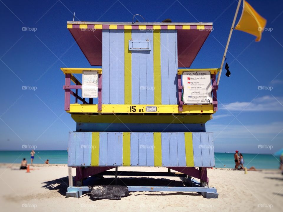 Beach house in blue & yellow . colorful beach house with blue sky