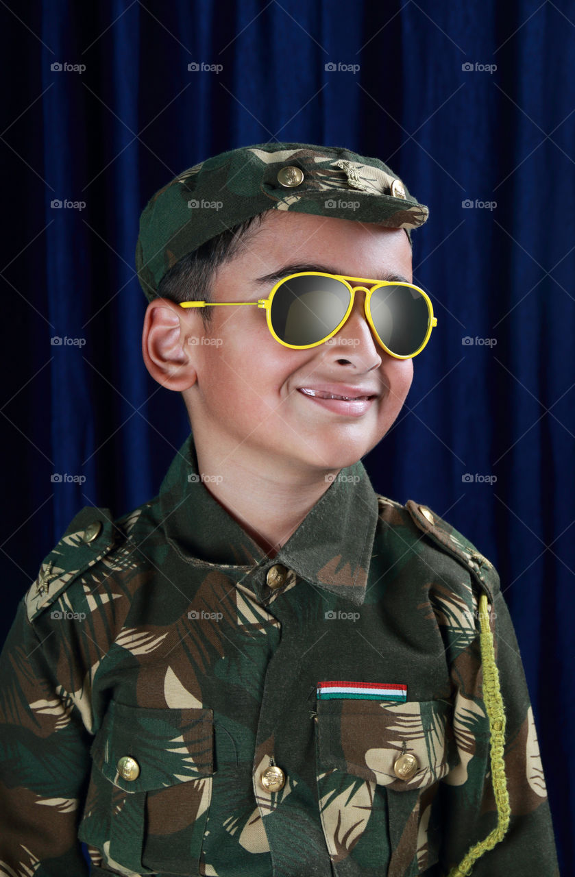 Indian boy dressed as a soldier