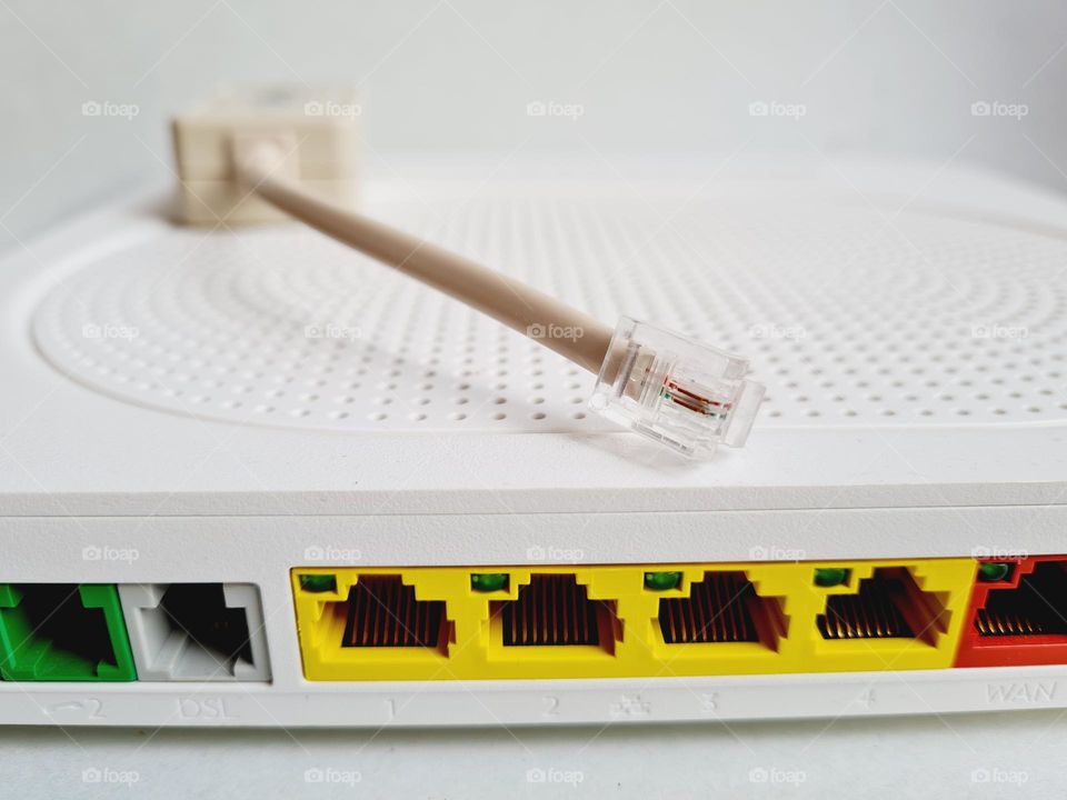 back of a modem router with colored network cables