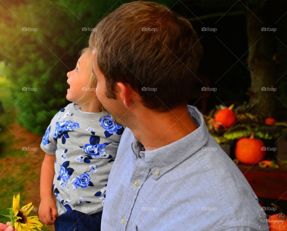 daddy and daughter letting butterflies go