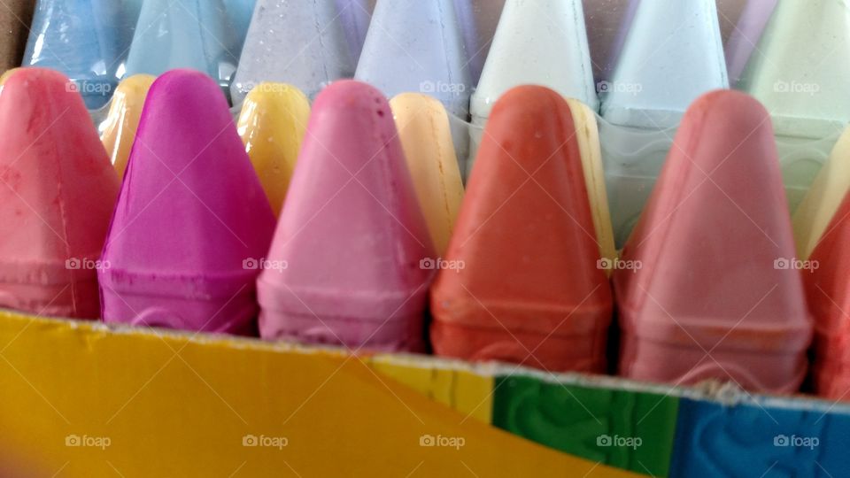 close up of colored chalk crayons