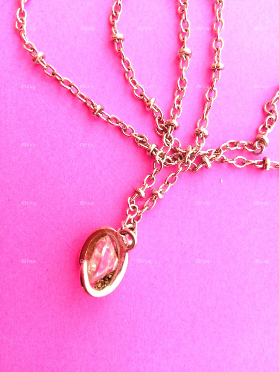 pendant on a pink background