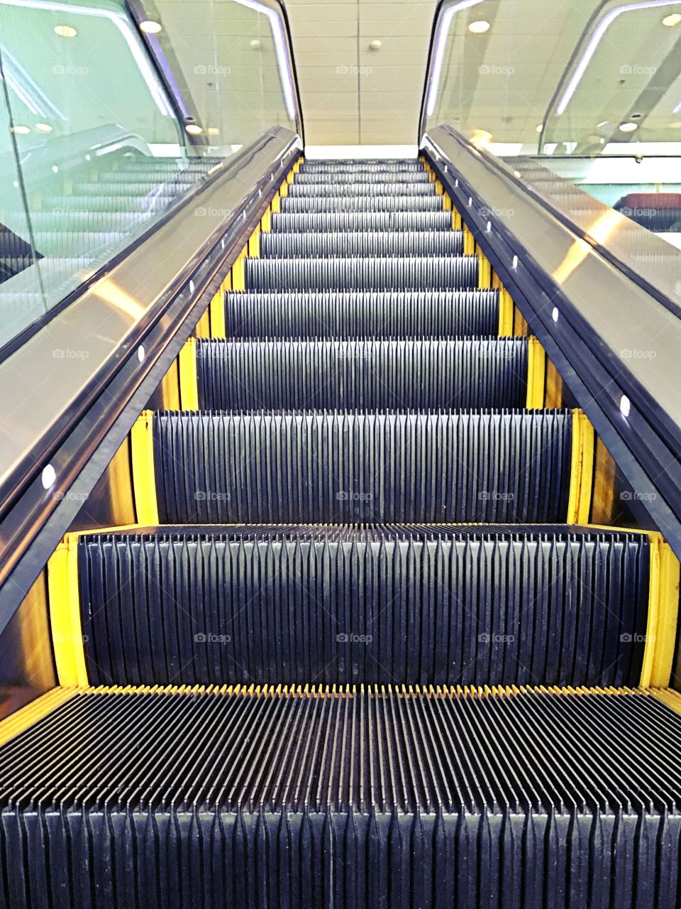 Looking up at an escalator 