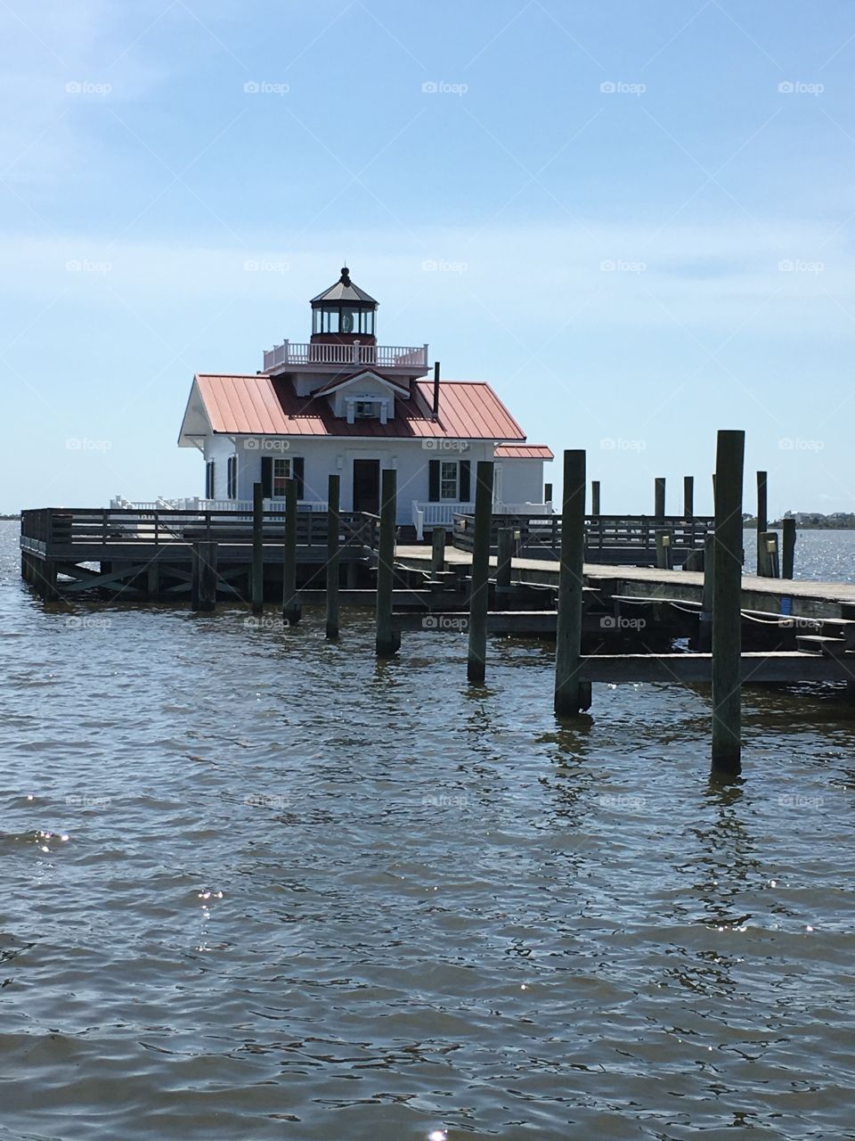 Roanoke Marshes Lighthouse a beautiful day at the waterfront in Manteo, NC