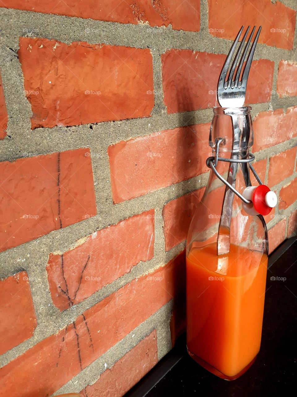 fork in juice bottle